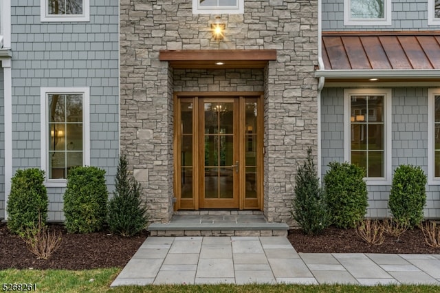 view of exterior entry featuring french doors