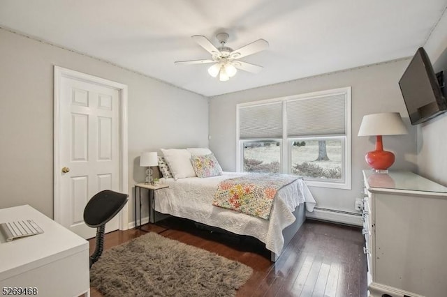 bedroom with dark wood-style floors, a baseboard radiator, and ceiling fan