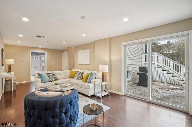 living area featuring recessed lighting, wood-type flooring, and baseboards