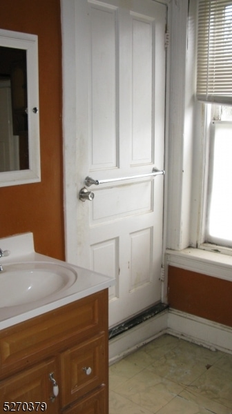 bathroom with vanity and tile patterned flooring