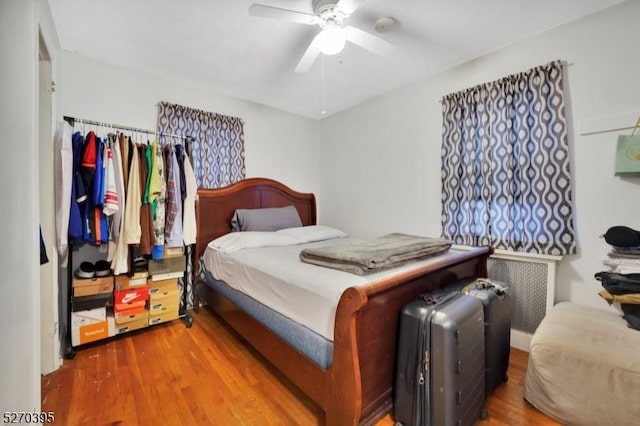 bedroom featuring ceiling fan and wood-type flooring