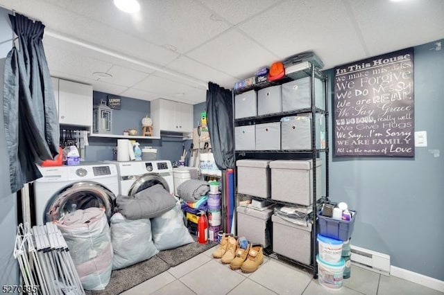 laundry area featuring light tile patterned floors and washing machine and dryer