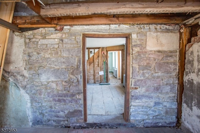 miscellaneous room featuring hardwood / wood-style floors and radiator heating unit