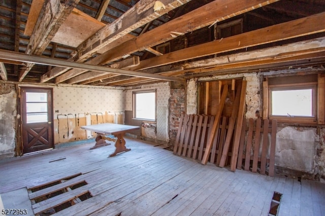 misc room with a healthy amount of sunlight and wood-type flooring