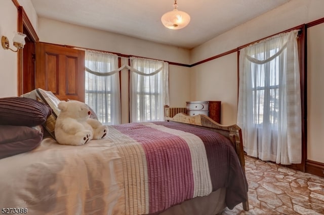 bedroom with light tile floors