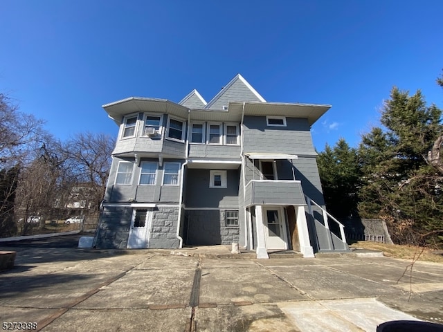 view of front of home with a balcony