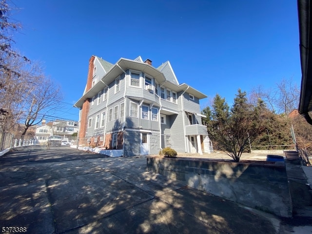 view of home's exterior with a balcony