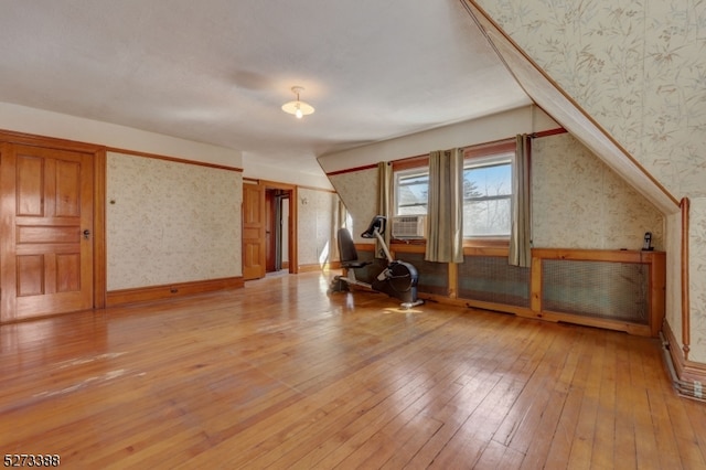 additional living space featuring light wood-type flooring