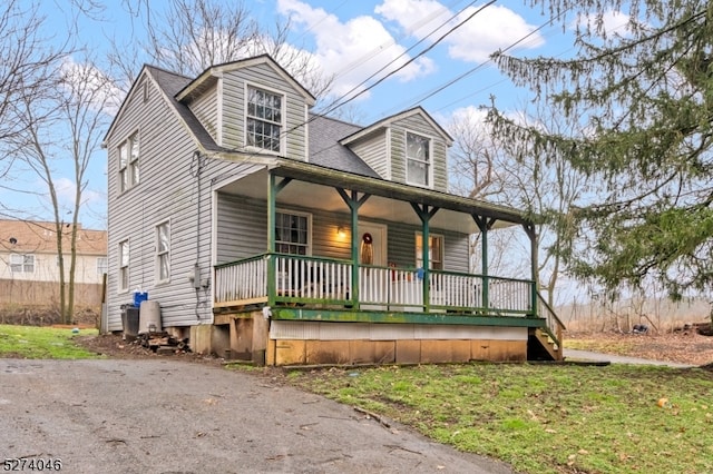 cape cod home with a porch