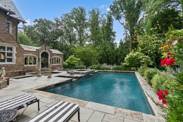 view of swimming pool featuring a patio area