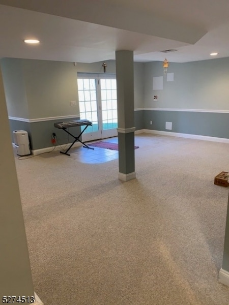 basement featuring carpet flooring