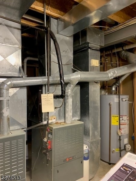 utility room featuring water heater