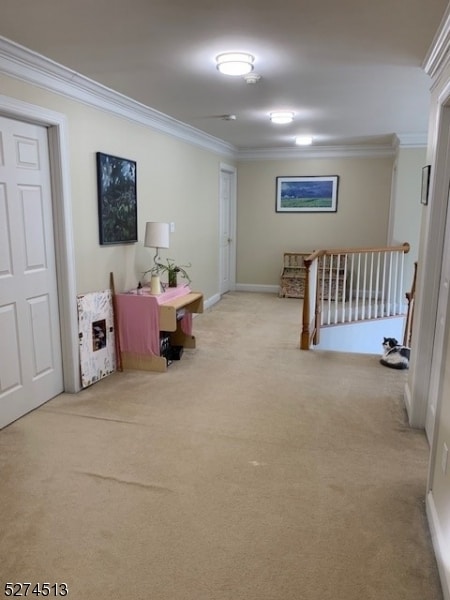 interior space with crown molding and carpet flooring