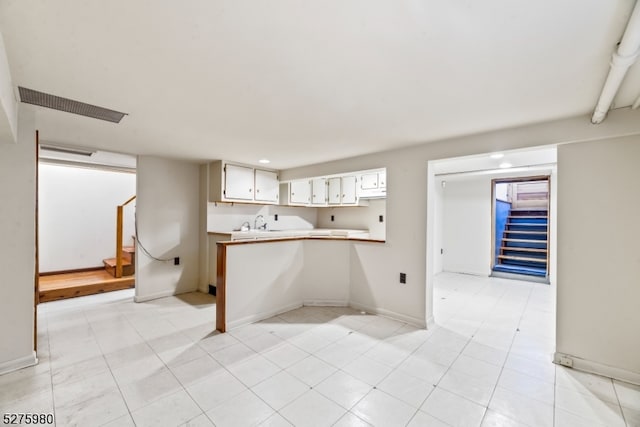 interior space featuring light tile flooring and sink