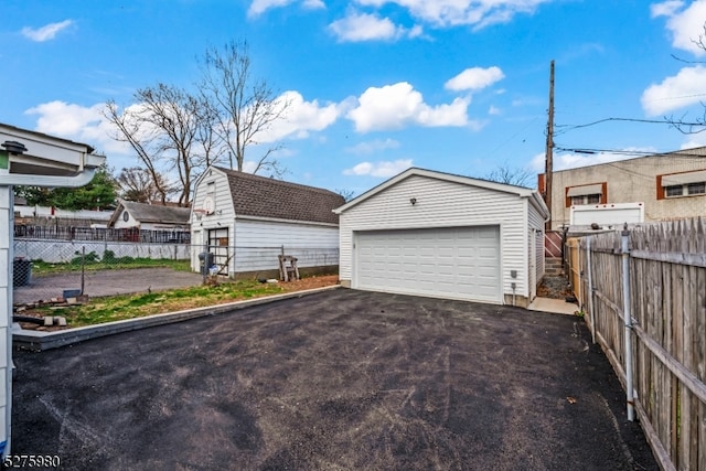 view of front of home with an outdoor structure and a garage