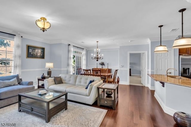 1103 Enclave Cir, Franklin Twp, NJ 08873 - living room featuring crown molding, dark wood-type flooring, and a chandelier