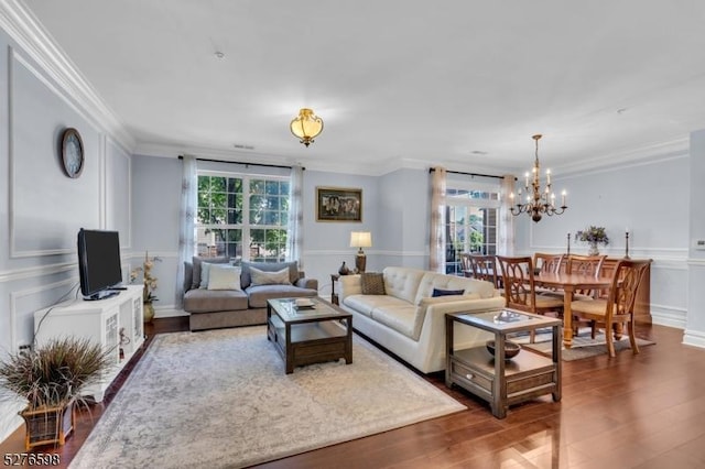 1103 Enclave Cir, Franklin Twp, NJ 08873 - living room featuring a chandelier, crown molding, wood finished floors, and a decorative wall