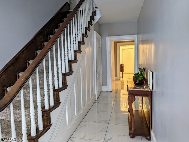 stairs with light tile floors