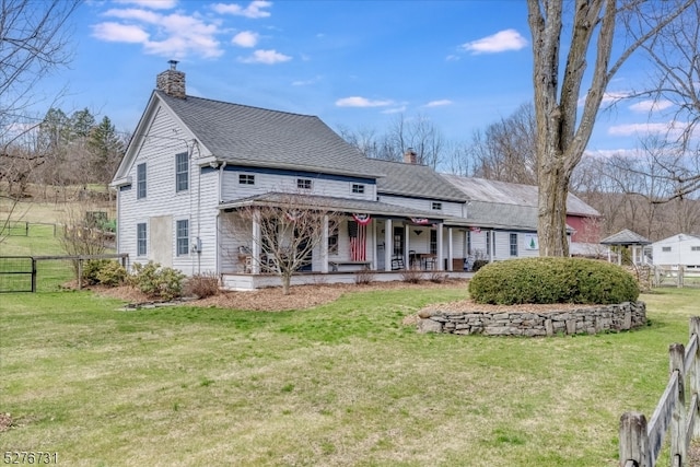 rear view of house with a lawn