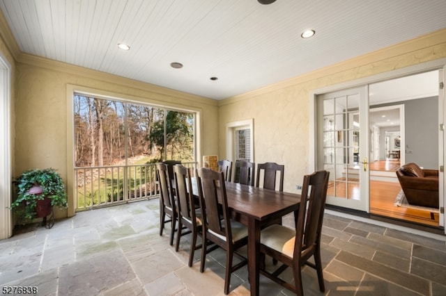 dining room with tile flooring, french doors, and ornamental molding