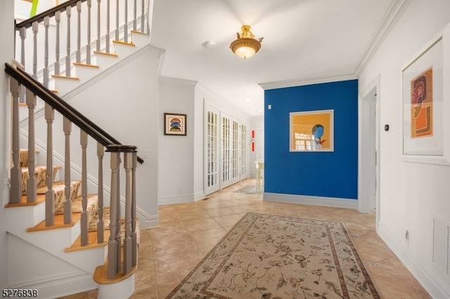 tiled entryway with ornamental molding