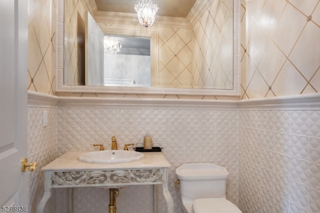 bathroom featuring large vanity, tasteful backsplash, toilet, and tile walls