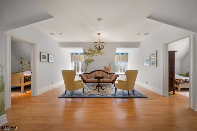 dining space featuring a notable chandelier and light wood-type flooring