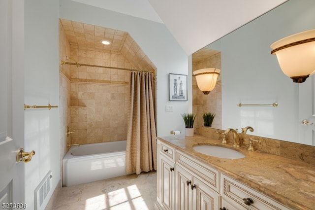 bathroom with tile flooring, vanity, and shower / tub combo