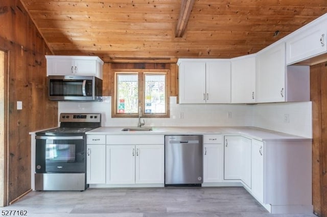 4 Amicalola Dr, Vernon Twp, NJ 07422 - kitchen with a sink, appliances with stainless steel finishes, backsplash, wooden ceiling, and vaulted ceiling