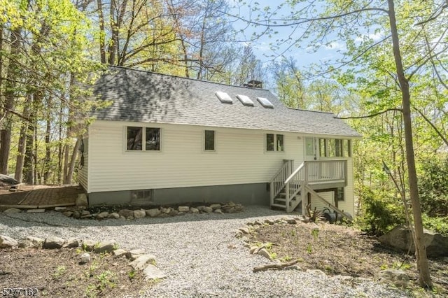 4 Amicalola Dr, Vernon Twp, NJ 07422 - rear view of house featuring stairway and a shingled roof