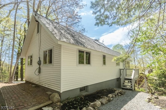 4 Amicalola Dr, Vernon Twp, NJ 07422 - view of side of home featuring roof with shingles