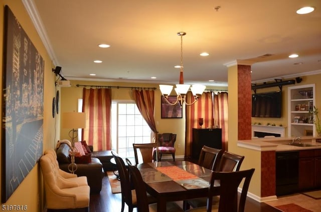 dining area with baseboards, ornamental molding, an inviting chandelier, and recessed lighting