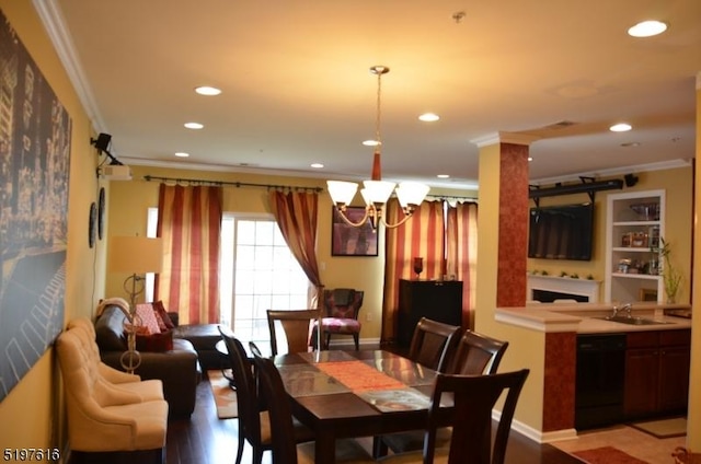 dining room with ornamental molding and recessed lighting