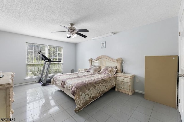 193 Columbus Dr Unit 193, Franklin Twp, NJ 08823 - tiled bedroom with a textured ceiling, ceiling fan, and baseboards