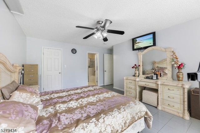 193 Columbus Dr Unit 193, Franklin Twp, NJ 08823 - bedroom with a textured ceiling, a ceiling fan, connected bathroom, and light tile patterned floors