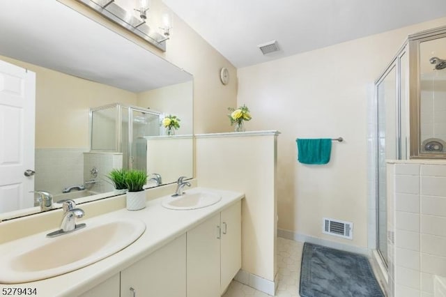 193 Columbus Dr Unit 193, Franklin Twp, NJ 08823 - bathroom with a shower stall, double vanity, and tile patterned flooring