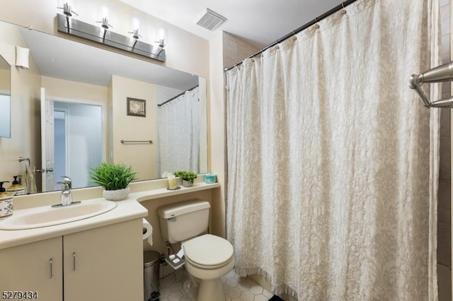193 Columbus Dr Unit 193, Franklin Twp, NJ 08823 - full bathroom with toilet, vanity, and tile patterned floors