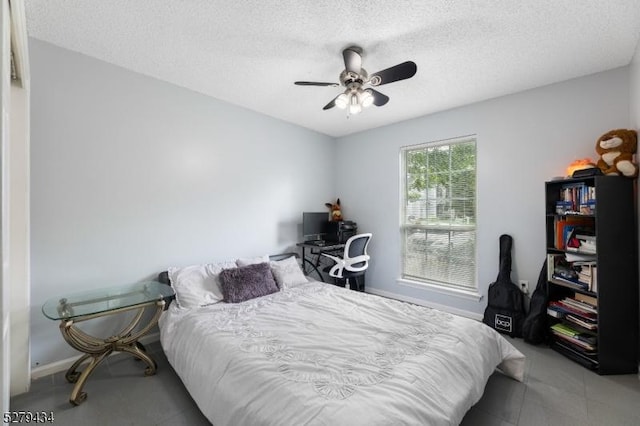 193 Columbus Dr Unit 193, Franklin Twp, NJ 08823 - bedroom featuring a textured ceiling, a ceiling fan, and baseboards