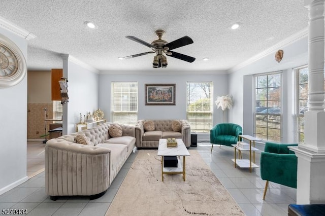 193 Columbus Dr Unit 193, Franklin Twp, NJ 08823 - living room with light tile patterned floors, ceiling fan, crown molding, a textured ceiling, and ornate columns