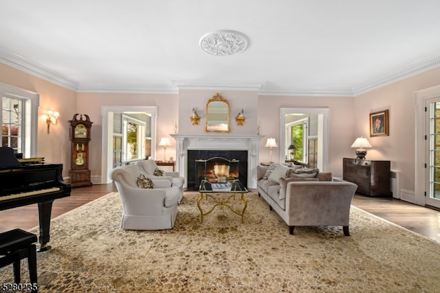 living room with wood-type flooring and crown molding