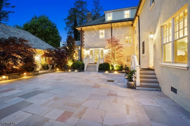 view of patio terrace at night