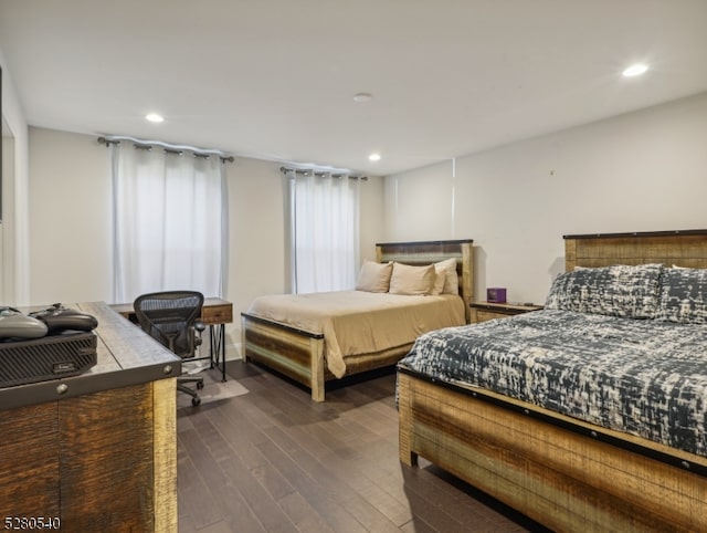 bedroom with dark wood-type flooring