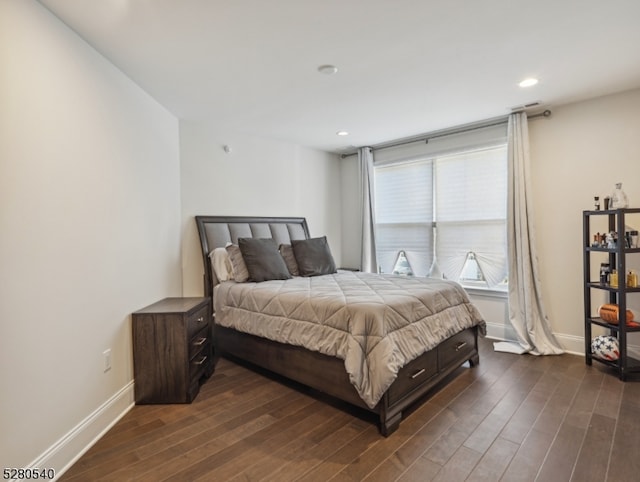 bedroom featuring dark hardwood / wood-style flooring