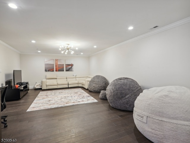 living room with ornamental molding, dark hardwood / wood-style flooring, and a chandelier