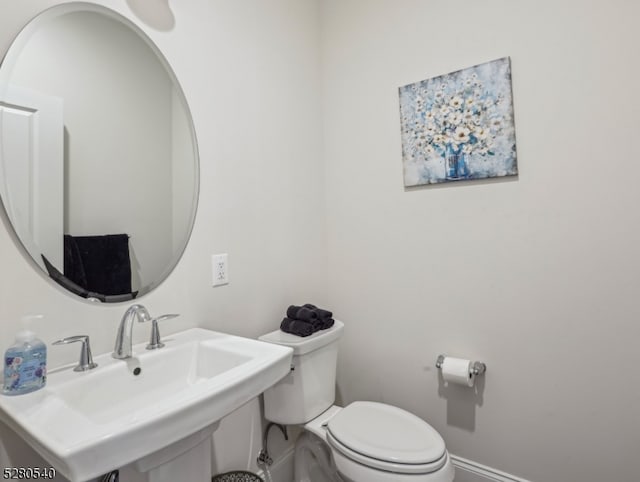 bathroom featuring sink and toilet