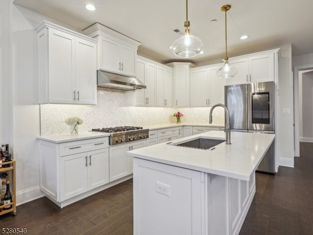 kitchen featuring appliances with stainless steel finishes, tasteful backsplash, and white cabinets