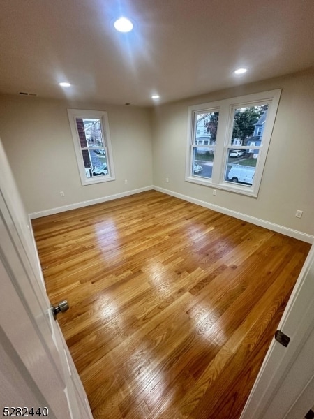 unfurnished room featuring light wood-type flooring