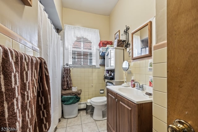 bathroom featuring vanity, tile walls, toilet, and tile patterned flooring