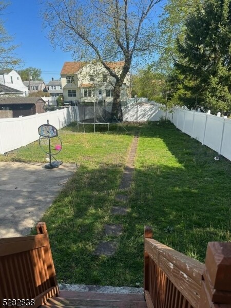 view of yard with a trampoline