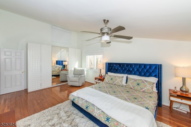 bedroom featuring a closet, hardwood / wood-style flooring, and ceiling fan